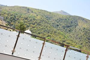a balcony with a view of a mountain at Khyber Guest House Swat in Saidu