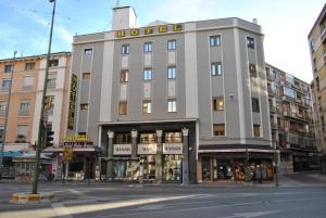 a building on the corner of a city street at Hotel Pedro Torres in Cuenca