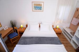 Postel nebo postele na pokoji v ubytování Novak Guesthouse - ZF Hvar