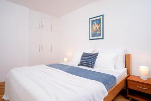 Postel nebo postele na pokoji v ubytování Novak Guesthouse - ZF Hvar