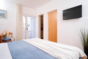 Postel nebo postele na pokoji v ubytování Novak Guesthouse - ZF Hvar
