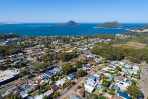 an aerial view of a town next to the water at Beach & Bay Holiday Rental - Nelson Bay in Nelson Bay