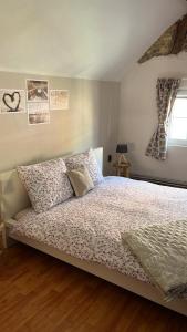 a bedroom with a bed and a window at RL Guesthouses in Geilenkirchen