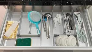 a drawer filled with utensils and utensils at Sandakan Homestay Apartment Forest Cabin 森林小屋 2R2B in Sandakan