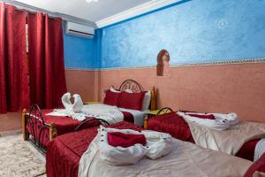 Cama o camas de una habitación en Hôtel Faouzi