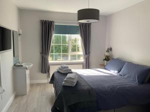 Letto o letti in una camera di The Lake House Dungloe