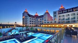 a view of a hotel with a swimming pool at Side Crown Serenity All Inclusive in Side