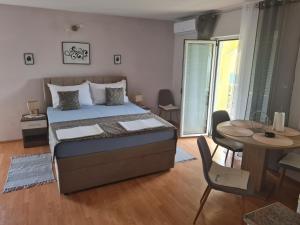 Postel nebo postele na pokoji v ubytování Apartments Bosnjak