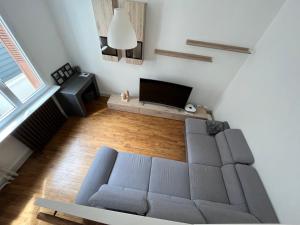 Televízia a/alebo spoločenská miestnosť v ubytovaní Maison Clermont Ferrand