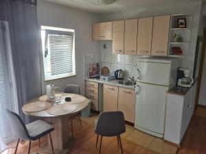 Kuchyň nebo kuchyňský kout v ubytování Apartments Bosnjak