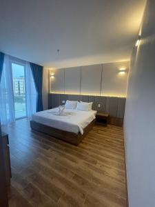Postel nebo postele na pokoji v ubytování HO TRAM GOLDEN HOTEL