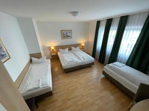 Letto o letti in una camera di Hafner Hotel Apartment Self Check-In Anytime