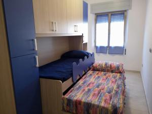 Postel nebo postele na pokoji v ubytování casa vacanze AG