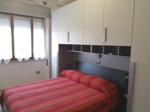 Postel nebo postele na pokoji v ubytování casa vacanze AG