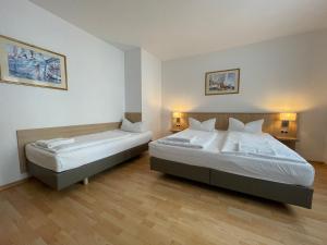Letto o letti in una camera di Hafner Hotel Apartment Self Check-In Anytime