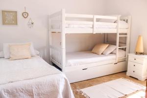 A bed or beds in a room at LUXURY STYLE VILLA AURORA Roche Még 37 kép