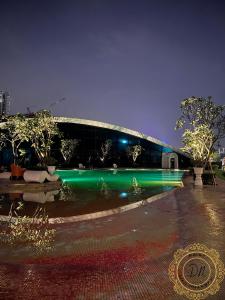 a building with green lights in front of it at ARTE Mont Kiara Relax & Go_Jacuzzi in Kuala Lumpur
