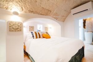 Postel nebo postele na pokoji v ubytování Apulia Charming Suites - Casa Lonfo Suite Sole