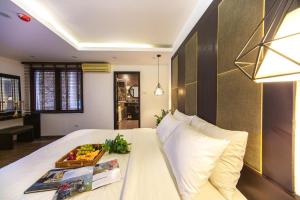 Voodi või voodid majutusasutuse Keypad Hotel - 24 Hang Ga toas