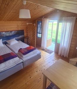 Postel nebo postele na pokoji v ubytování Freja Vandrarhem