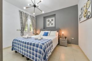 Posteľ alebo postele v izbe v ubytovaní Villas Guzman - Tango