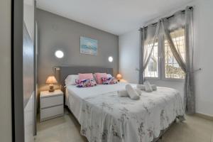Posteľ alebo postele v izbe v ubytovaní Villas Guzman - Tango