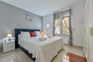 Posteľ alebo postele v izbe v ubytovaní Villas Guzman - Tango