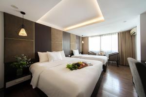 Voodi või voodid majutusasutuse Keypad Hotel - 24 Hang Ga toas
