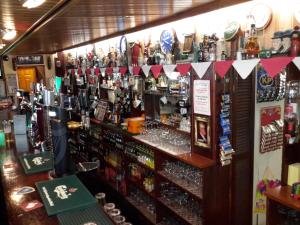 a bar with a lot of bottles of alcohol at Bridge Hotel in Arklow