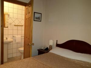 Postel nebo postele na pokoji v ubytování Bridge Hotel + 37 fotografií