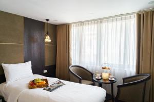 Voodi või voodid majutusasutuse Keypad Hotel - 24 Hang Ga toas