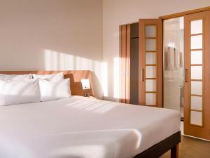 Ένα ή περισσότερα κρεβάτια σε δωμάτιο στο Novotel Gaziantep