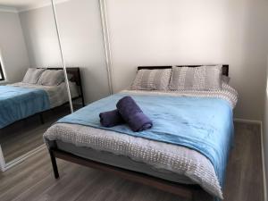 Кровать или кровати в номере Birubi Beach House