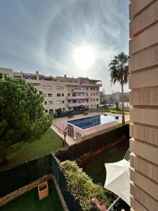 a view of a building with a swimming pool at APARTAMENTO LOS GIRASOLES 1 in Salou