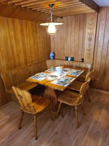 a dining room with a wooden table and chairs at Traditional chalet in Wengen in Wengen