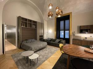 a living room with a couch and a table at Le Dimore del Toscano in Catania