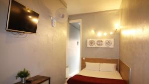 Posteľ alebo postele v izbe v ubytovaní Paraiso Hostel