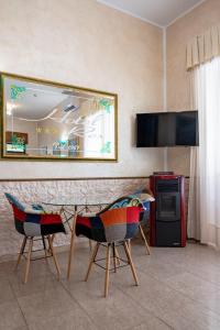TV a/nebo společenská místnost v ubytování Hotel Rex