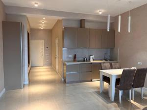 A kitchen or kitchenette at Apartment in Sea Breeze - Park Residence