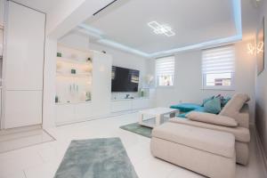 TV a/nebo společenská místnost v ubytování Apartman Pascal