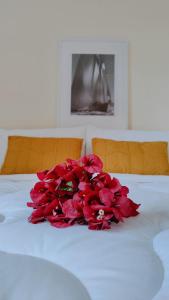 En eller flere senge i et værelse på Hotel Villa Margarit