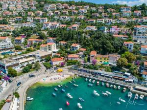 an aerial view of a harbor in a town at Apartment Suzie Q - Intermezzo with sea view in Rabac