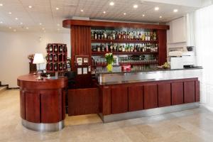 a bar in a restaurant with a counter at Hotel Ravello da Lorenzo e Moira Adults only in Rimini