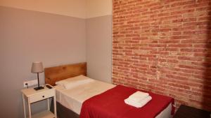 Posteľ alebo postele v izbe v ubytovaní Paraiso Hostel