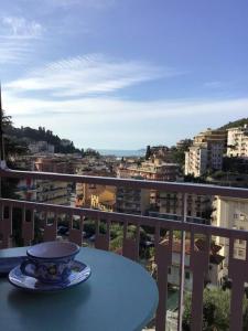 a cup and saucer on a table on a balcony at Solare residenza vista mare in Rapallo
