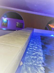 a indoor swimming pool in a room with a swimming pool at gîtes Studio de tourisme du Domaine Piscine Spa Balnéo in Lescout