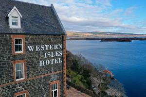 a building with a sign that reads western isles hotel at Western Isles Hotel in Tobermory