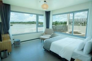 Letto o letti in una camera di Cube9 Resort & Spa 큐브9 리조트 & 스파