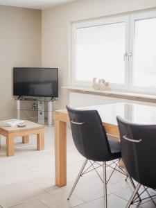 TV a/nebo společenská místnost v ubytování Appartement Meyer-Ernzen