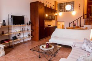 a living room with a couch and a table at ZeusPlace House Marousso in Litochoro